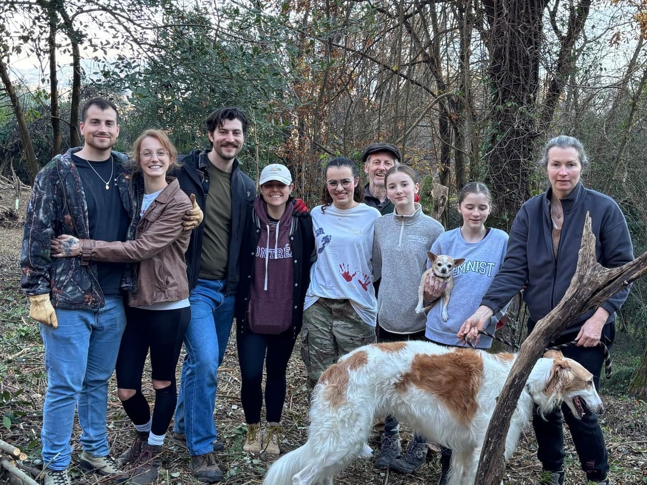 Group of volunteers working together at the reforestation site